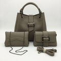 Olive-taupe three-piece bag set with silver-tone buckle details