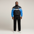 Model wearing the black and blue colourblock track jacket