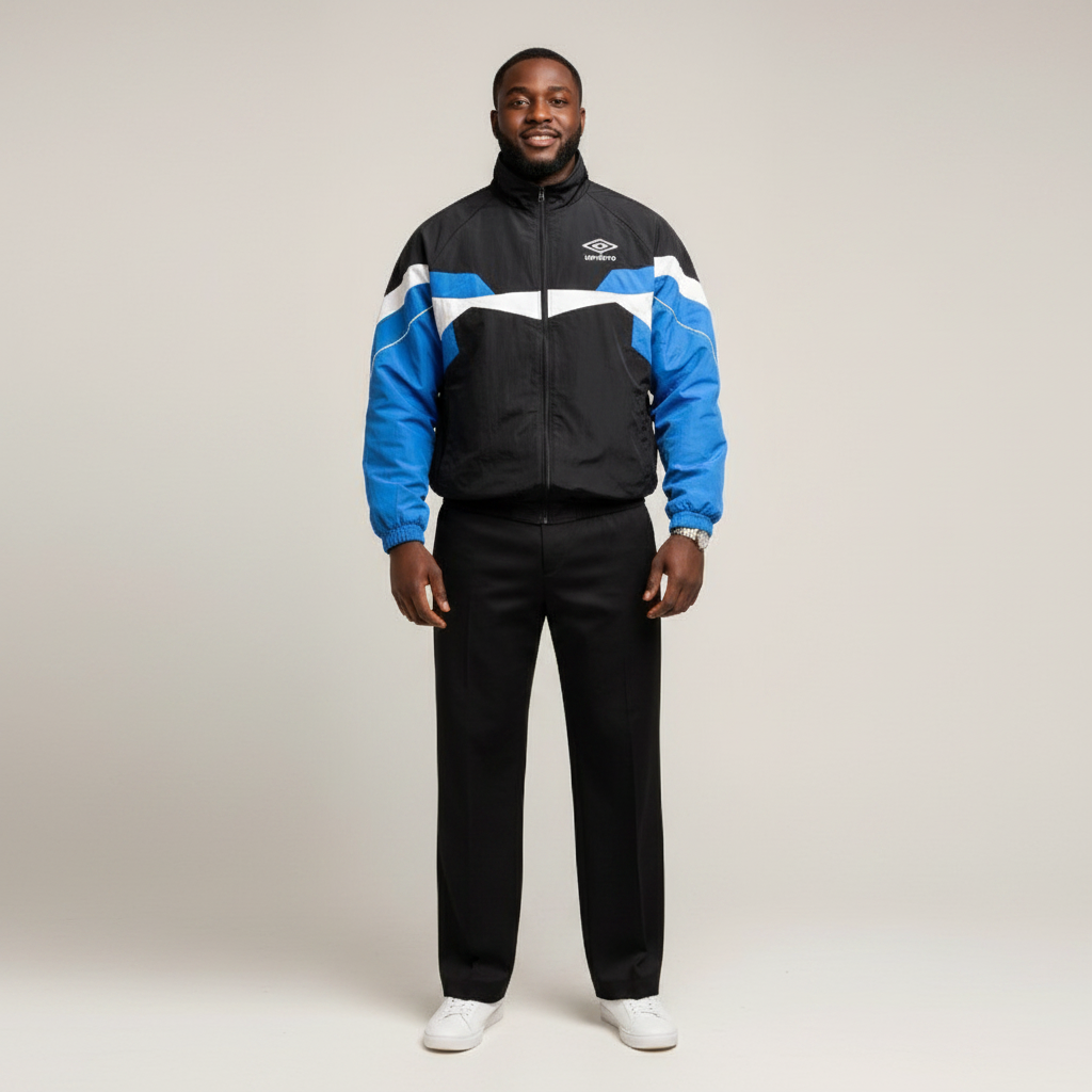 Model wearing the black and blue colourblock track jacket