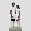 Nigerian male and female models wearing the Unisex White Home Football Jersey side by side
