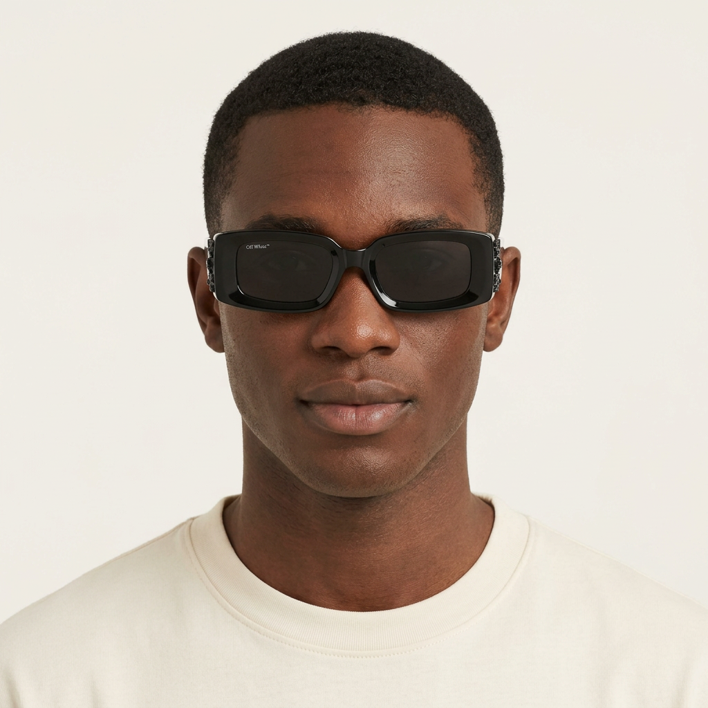 Nigerian Black male model wearing chunky black rectangular sunglasses