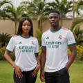 Nigerian female and male models wearing white teal and pink trim football jersey