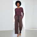 Female model wearing mauve wide-leg sweatpants