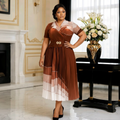 Nigerian model wearing rust cream ombré pleated midi dress