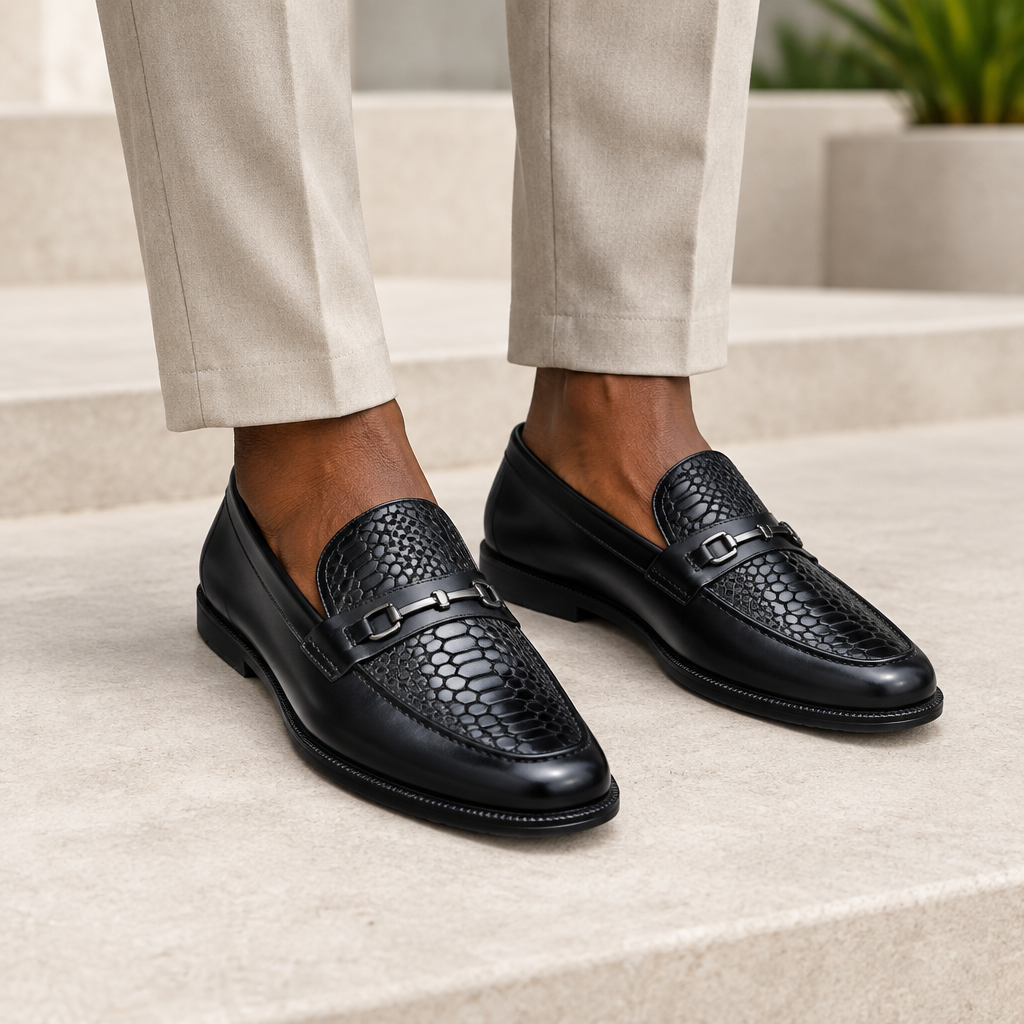 Black model wearing black men's embossed-texture buckle loafers