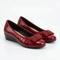 Matching red glossy croc-embossed bow wedge shoes