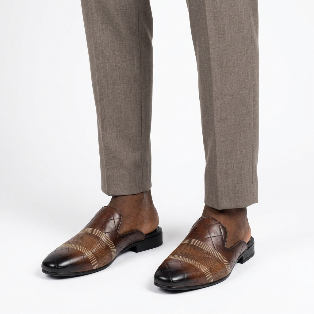 Men’s brown quilted mule shoes worn with tailored trousers