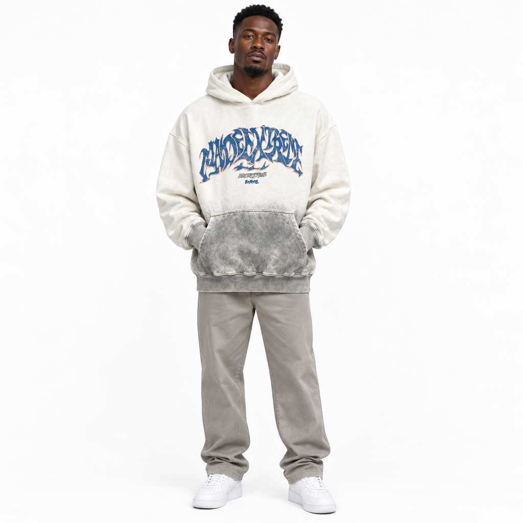 Black Nigerian man wearing white-grey graffiti hoodie