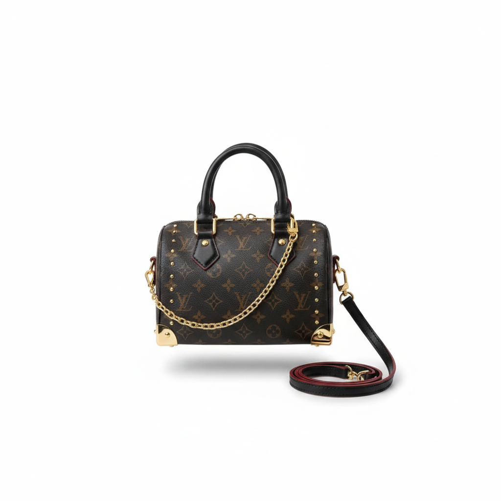 Dark monogram mini speedy bag with gold studs and burgundy trim on white background