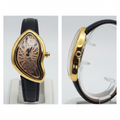 Asymmetric yellow gold skeleton dial watch with black strap front and side view