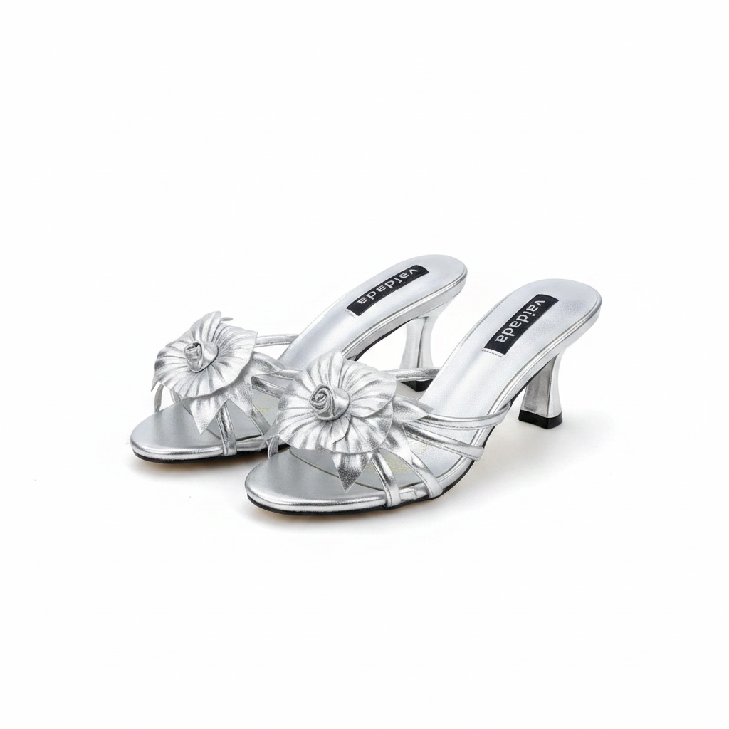 Ghost mannequin pair view of silver metallic floral kitten heel slide mules