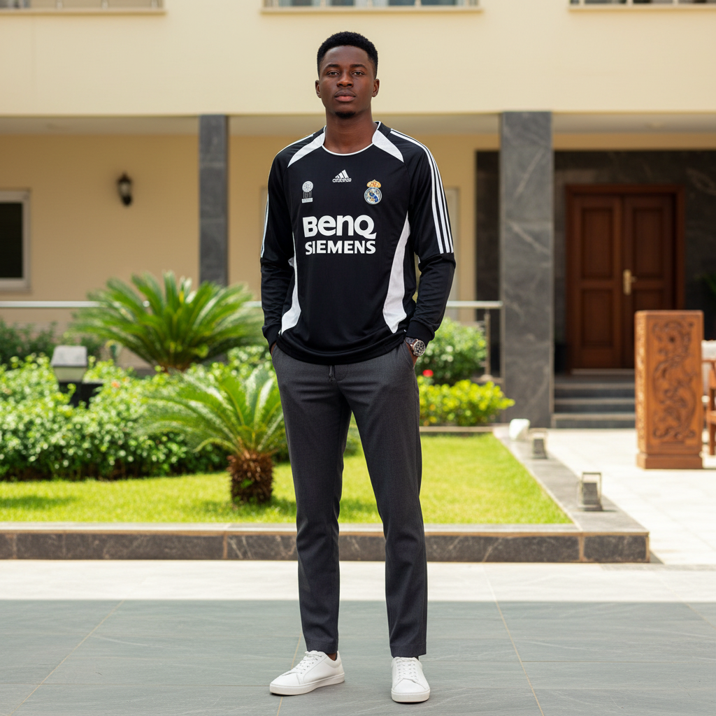 Black and white panel long-sleeve retro football jersey — Nigerian male model front view