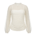 Ivory ruched blouse with dotted sheer sleeves and yoke on an invisible mannequin against white