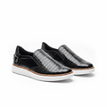 Men's black croc-embossed leather slip-on sneakers with buckle detail pair product shot