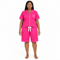 Adult model wearing hot pink pajama shirt and longer shorts