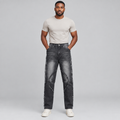Black Nigerian man wearing charcoal curved-panel straight jeans