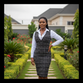 Nigerian female model wearing women's black tweed grid two-piece office dress set