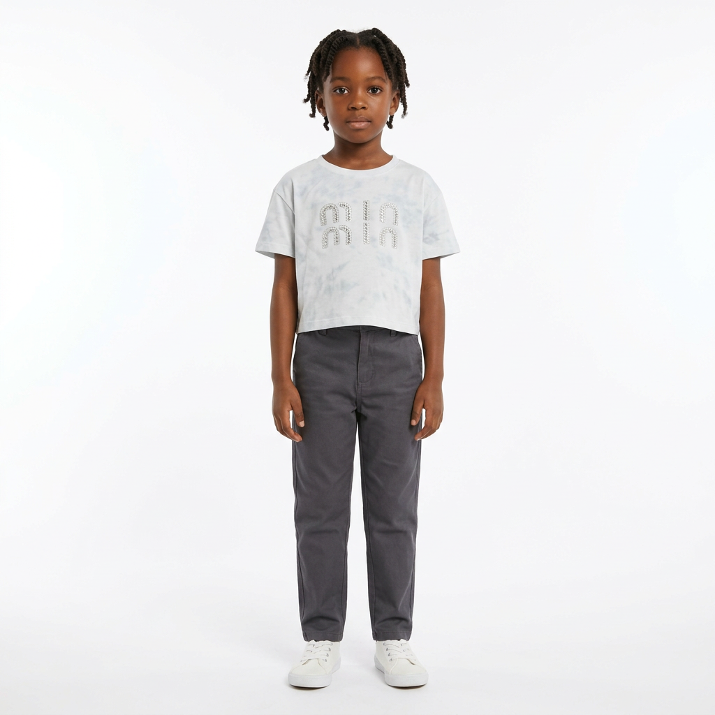 Full-body child model wearing a light-grey rhinestone-detail T-shirt