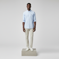 Nigerian male model wearing powder blue plain long-sleeved shirt, front view