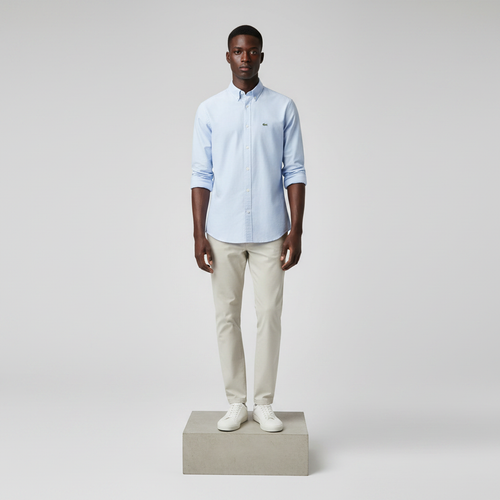 Nigerian male model wearing powder blue plain long-sleeved shirt, front view