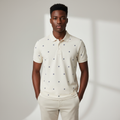 Nigerian model wearing cream ship wheel print polo shirt