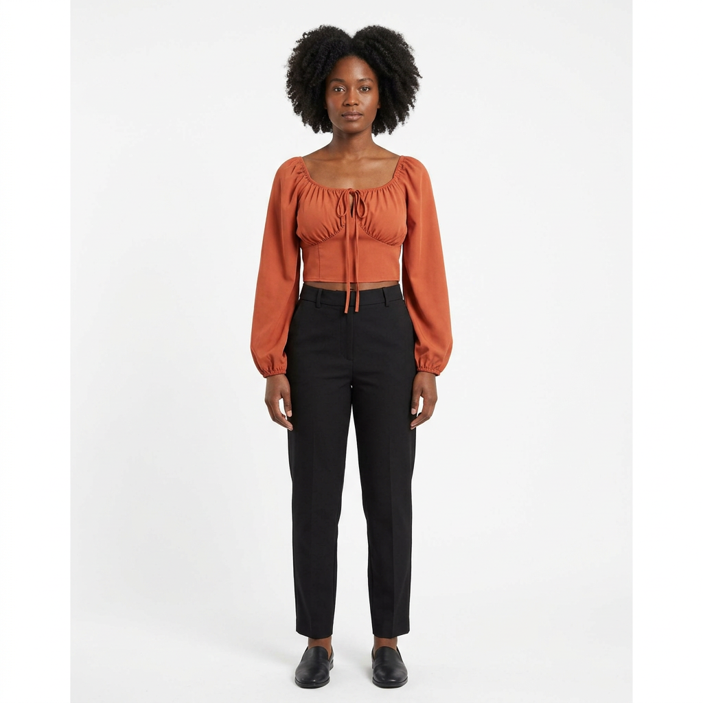 Full-body adult Black woman wearing a rust-orange cropped tie-front blouse