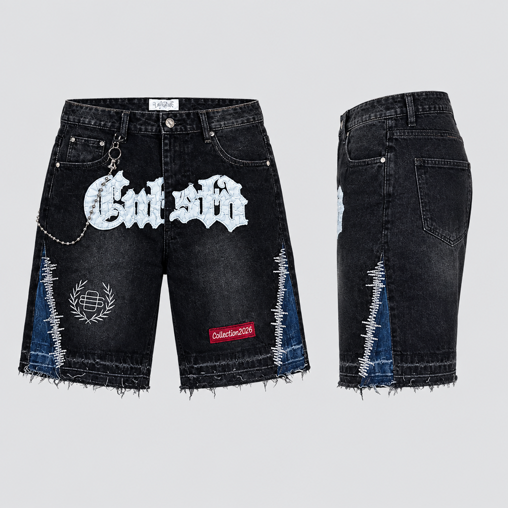 Black washed denim shorts with white graphic lettering, blue panels and chain