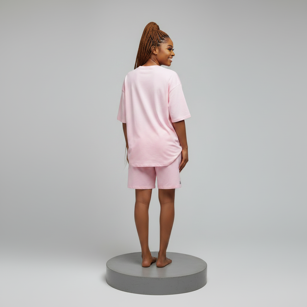 Nigerian female model back view plain - pink Hello Kitty rhinestone top and shorts set