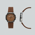 Brown textured dial watch with brown grooved strap, polished case, and dark bezel shown from the front and side