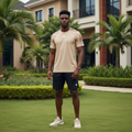 Nigerian male model wearing beige tonal shoulder-band short-sleeve sports jersey