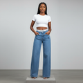 Nigerian female model wearing light blue CK wide-leg high-rise jeans