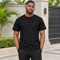 Black Nigerian adult model wearing a black basic T-shirt