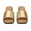 Gold block heel slide sandals with a wide single strap and brown heel, full pair shown straight-on from the front