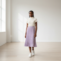 Nigerian teenage girl wearing lavender accordion pleated midi skirt