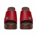 Red platform clog mules with a three-bar metal trim on the strap, full pair shown straight-on from the front