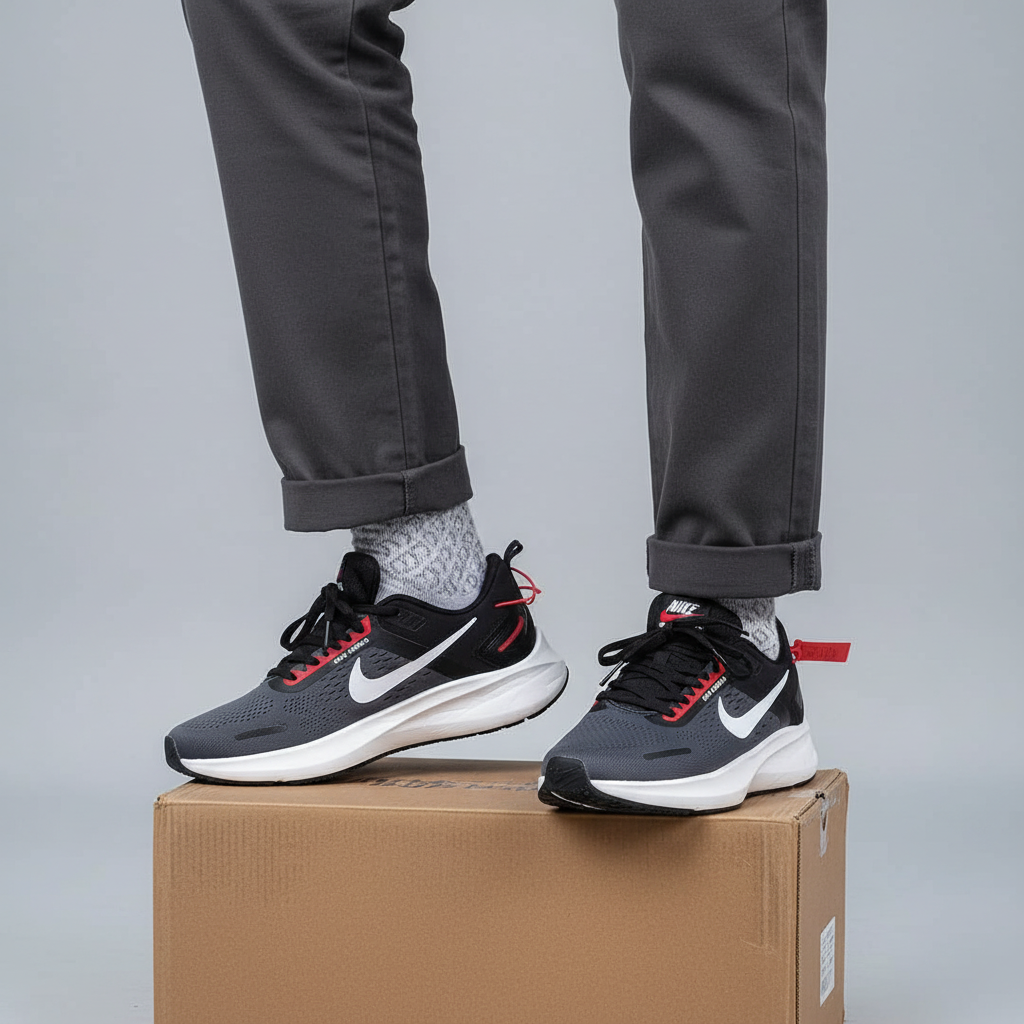 Men's dark grey and black athletic running sneakers Nigerian male model leg shot