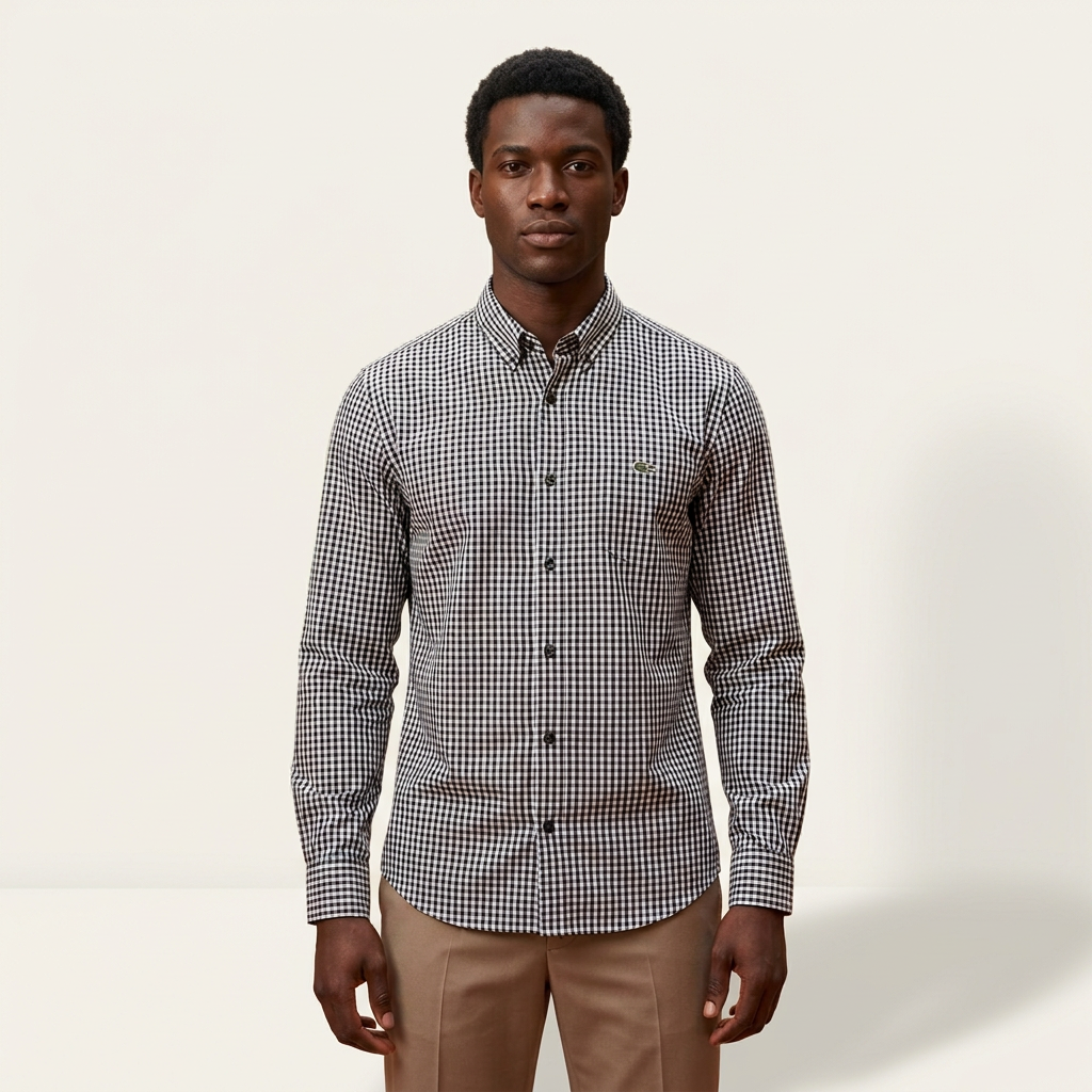 Male model wearing a black and white gingham long-sleeve shirt against a plain off-white background