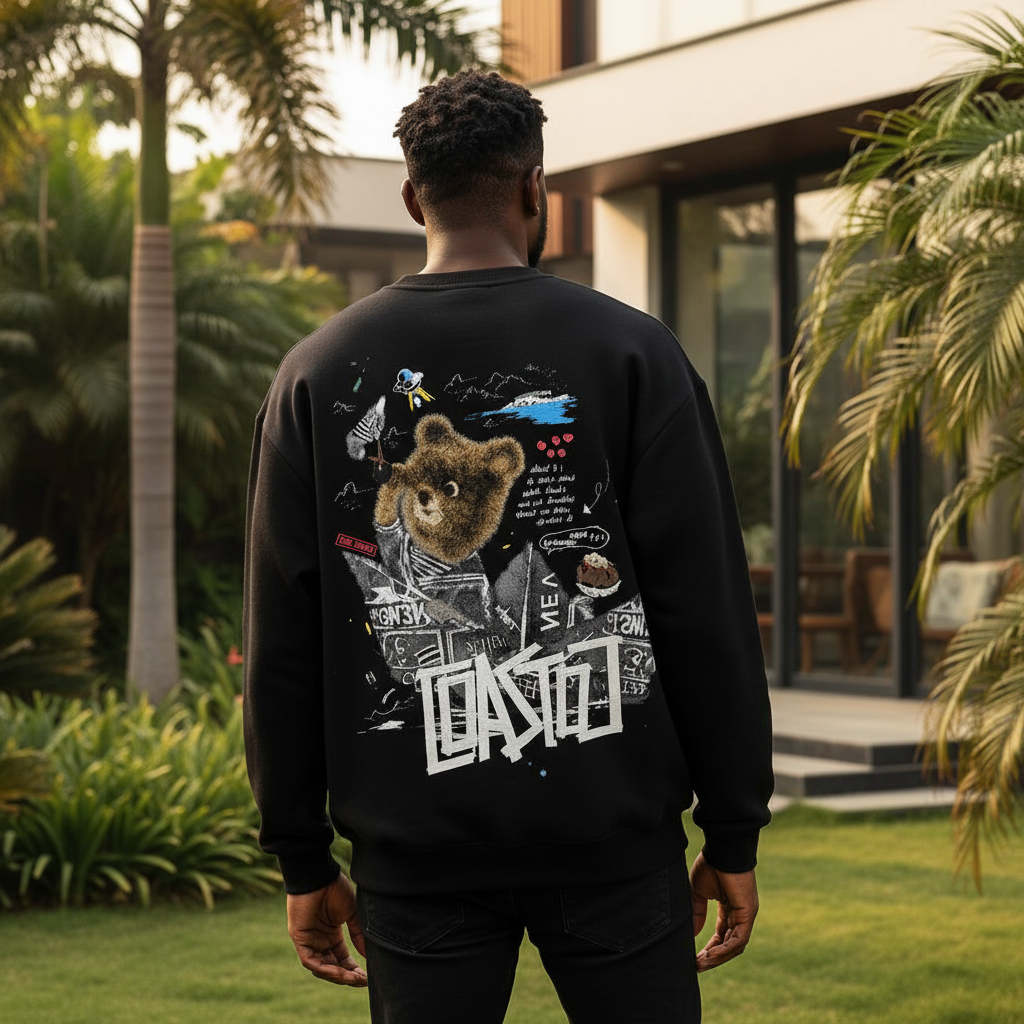 Nigerian male model wearing black sweatshirt with teddy bear collage back graphic – back view