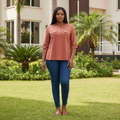 Terracotta roll-tab sleeve snap blouse - front model view
