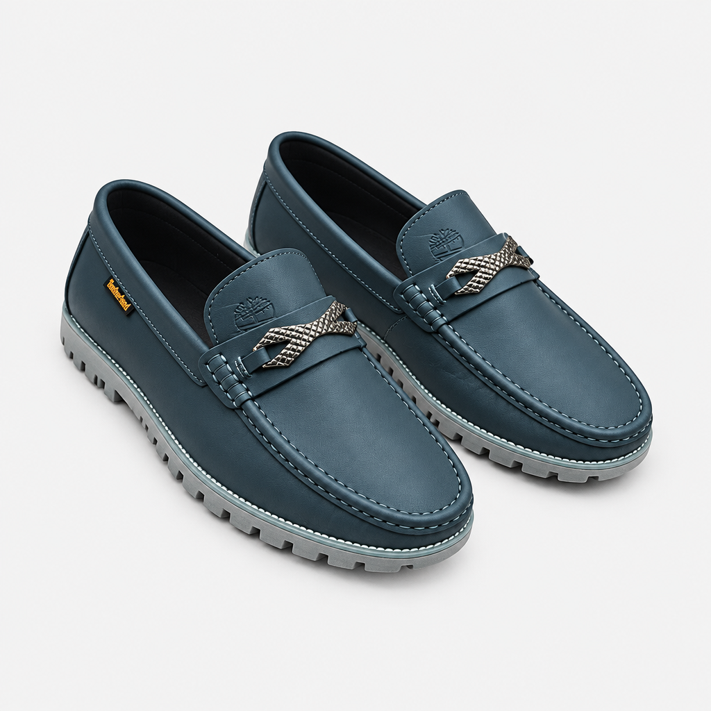 Slate blue men's slip-on loafers with woven detail shown as a complete pair