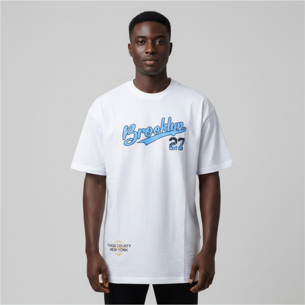 Black Nigerian male model wearing a white Brooklyn 27 graphic T-shirt