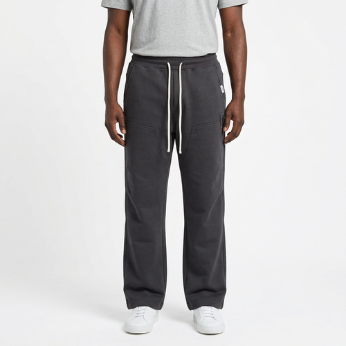 Adult Black model wearing charcoal grey straight-leg joggers with white drawstrings