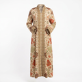 Cream floral abaya ghost image matching the model’s straight drape and bent sleeves