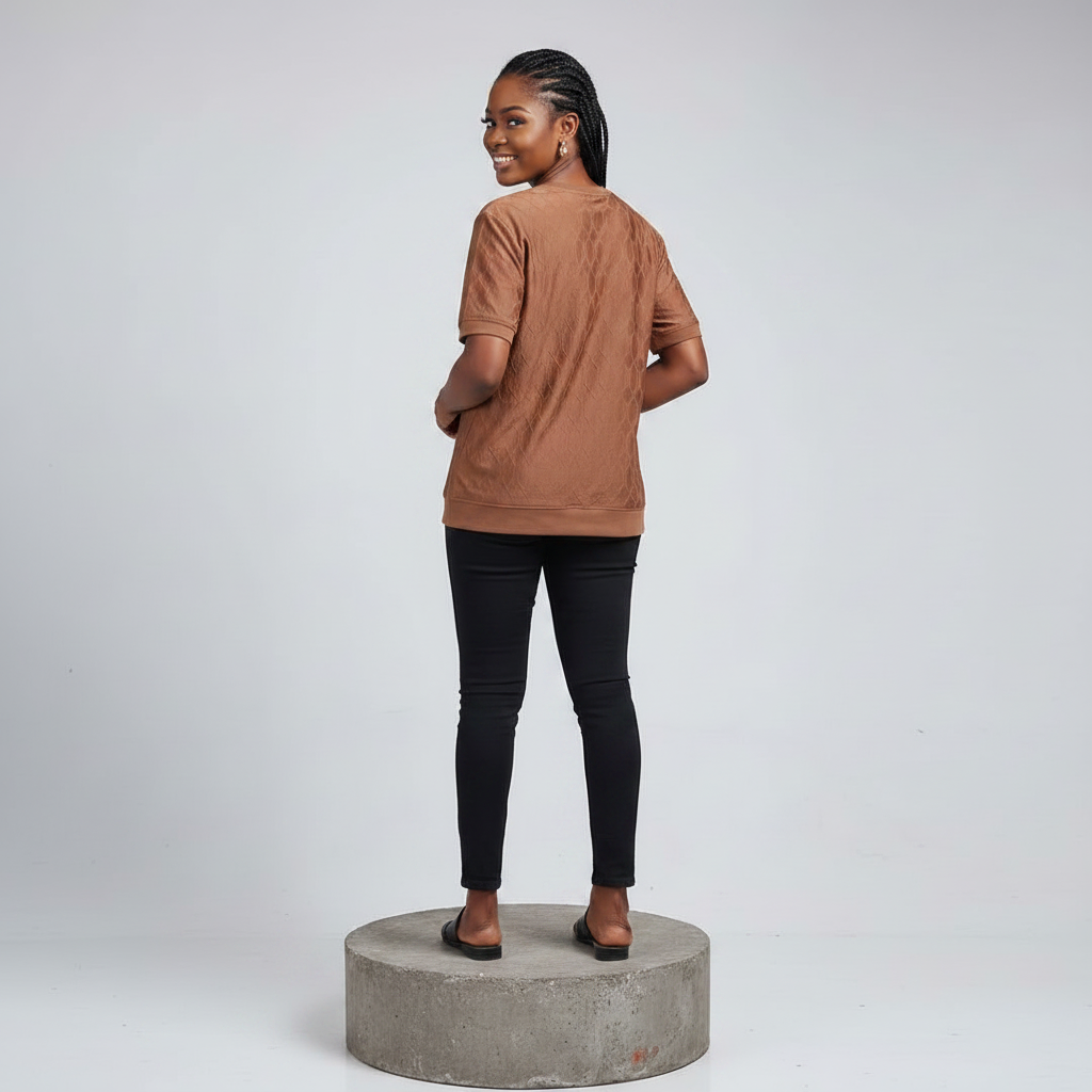 Nigerian female model back view wearing brown quilted T-shirt - consistent model