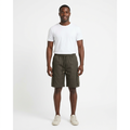 Full-body model wearing dark olive cargo shorts