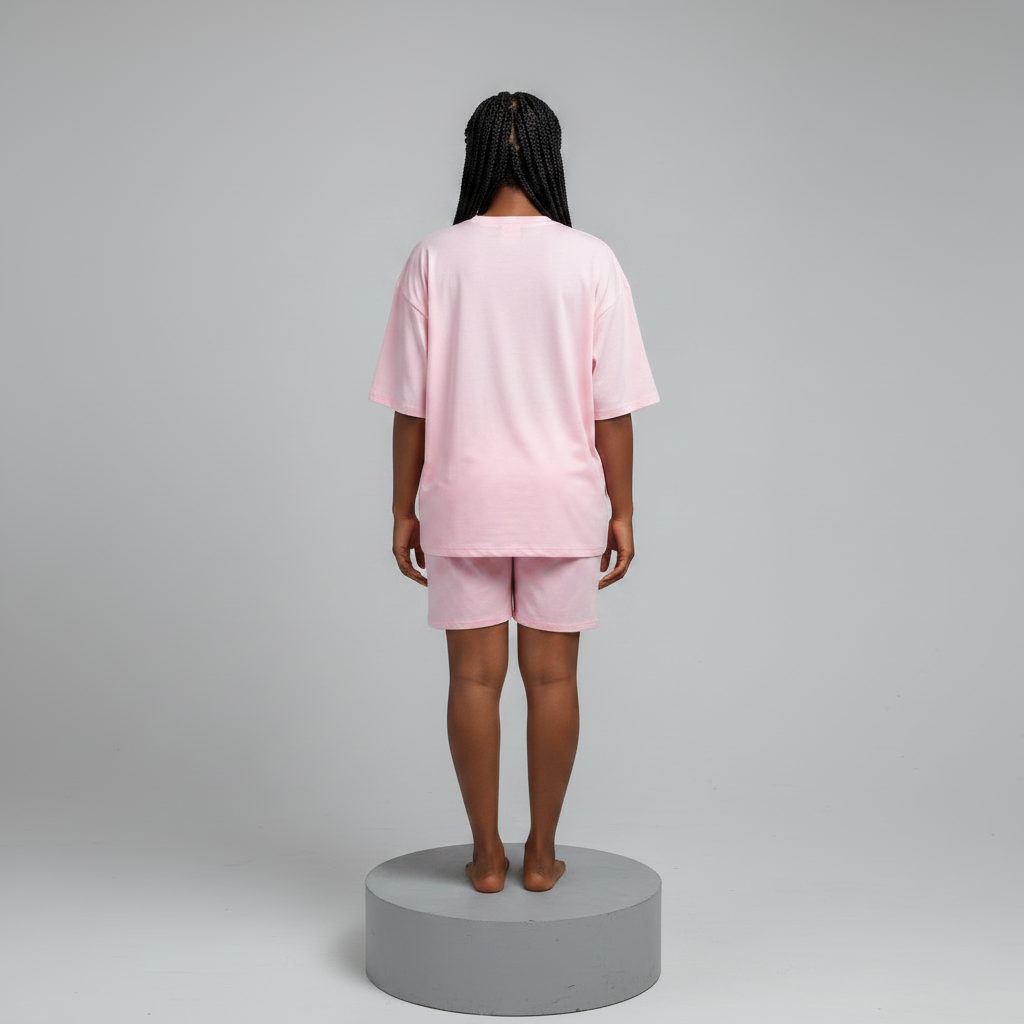 Nigerian female model back view - pink cascading rhinestone top and shorts set