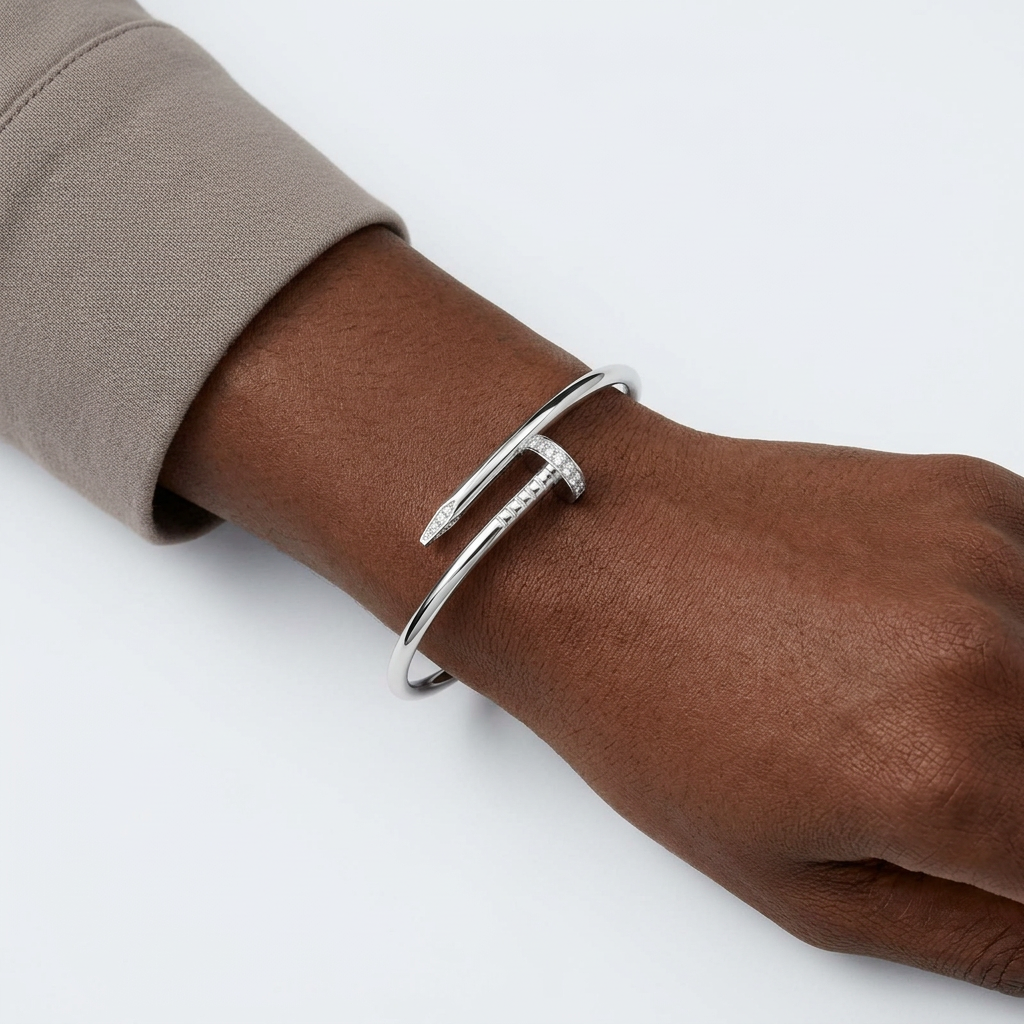 Silver-colour geometric nail bracelet on a Black adult wrist