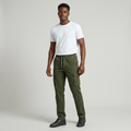 Nigerian man wearing olive flap-pocket cargo trousers in a light grey studio