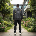 Nigerian male model wearing charcoal sweatshirt with bubble letter cartoon back graphic – back view