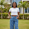 Women's Mid-Blue Cartoon Face Print Wide-Leg Jeans – Front Model View